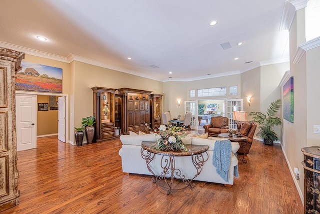 living room featuring baseboards, recessed lighting, and wood finished floors