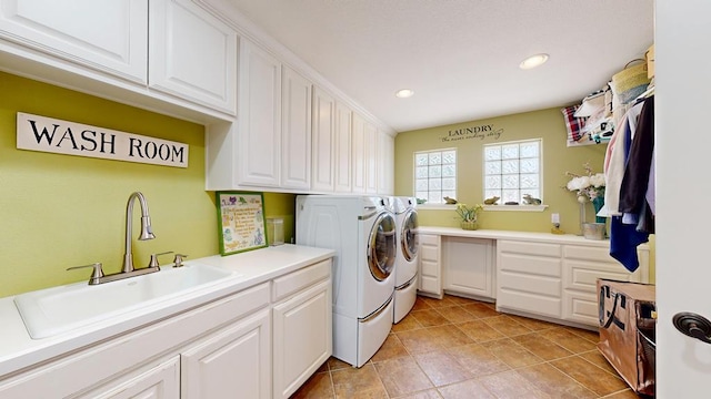 clothes washing area with cabinet space, a sink, separate washer and dryer, recessed lighting, and light tile patterned flooring