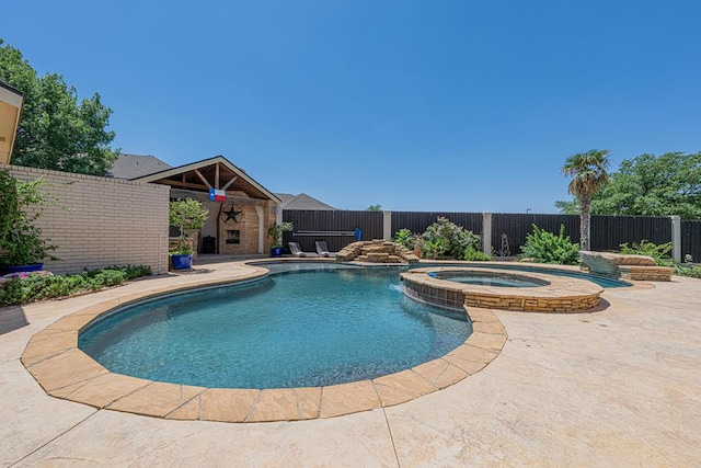 view of swimming pool with a fenced in pool, a patio, an in ground hot tub, and a fenced backyard