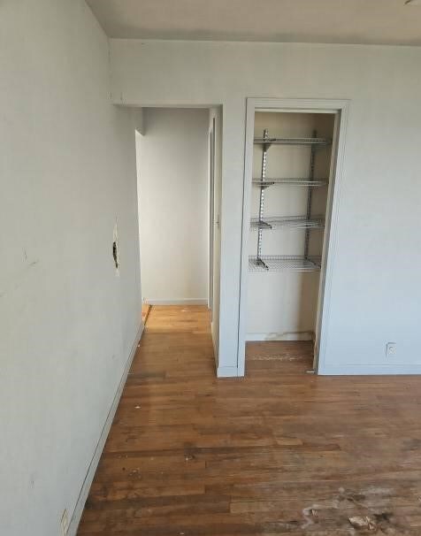 hallway with dark wood-type flooring