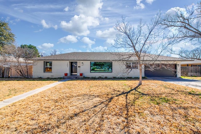 single story home with a garage and a front lawn