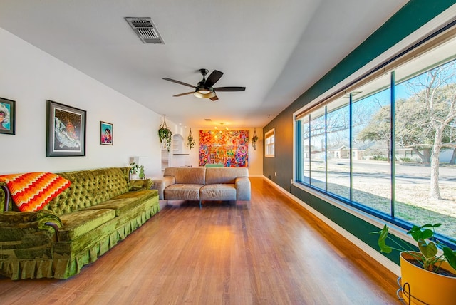 living room with hardwood / wood-style floors and ceiling fan