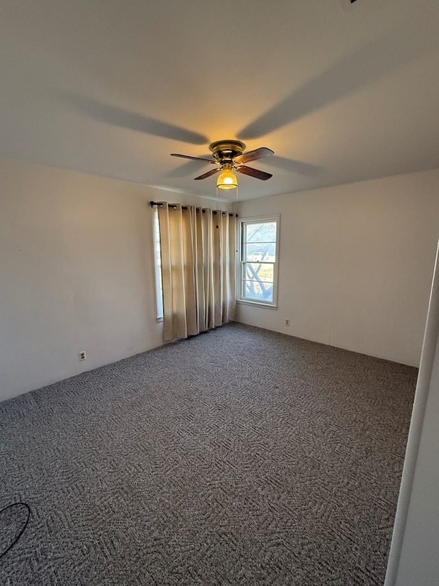 carpeted empty room with ceiling fan