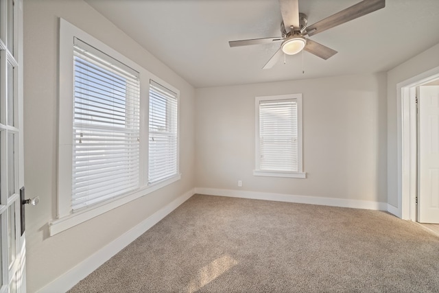 709 E 14th St, Big Spring, TX 79720 - carpeted empty room with a ceiling fan and baseboards