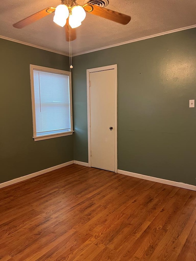 3702 Rose Cir, Snyder, TX 79549 - empty room featuring wood finished floors, a textured ceiling, ceiling fan, and crown molding