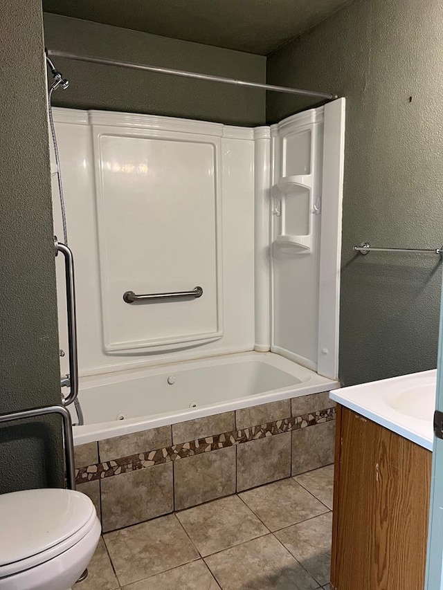 3702 Rose Cir, Snyder, TX 79549 - bathroom with a textured wall, tile patterned floors, and a combined bath / shower with jetted tub
