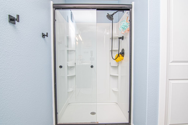 bathroom featuring an enclosed shower