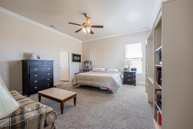 bedroom with visible vents, crown molding, baseboards, carpet floors, and a ceiling fan