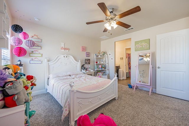 carpeted bedroom with visible vents, baseboards, and a ceiling fan