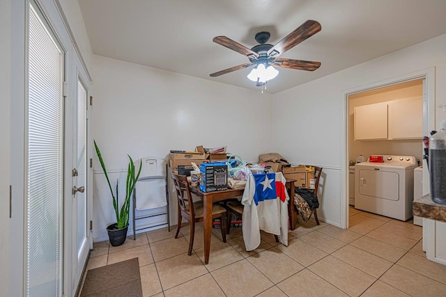 tiled dining room featuring ceiling fan and separate washer and dryer