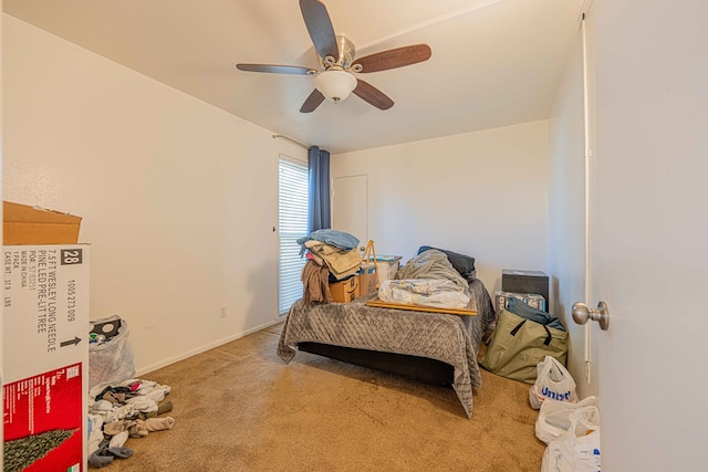 bedroom with ceiling fan and light colored carpet