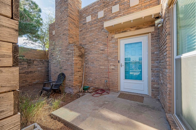 doorway to property with a patio