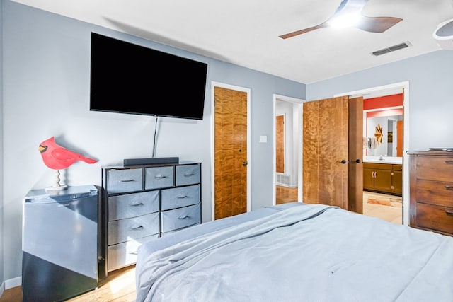 6413 Piedmont Dr, Odessa, TX 79762 - bedroom with visible vents, a ceiling fan, and ensuite bathroom