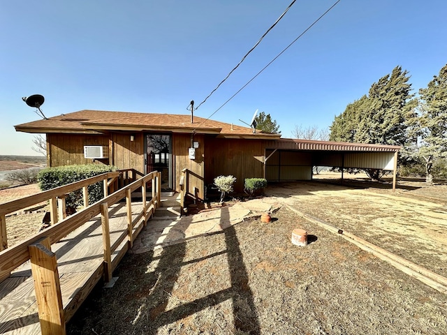 view of front of property featuring a carport and driveway