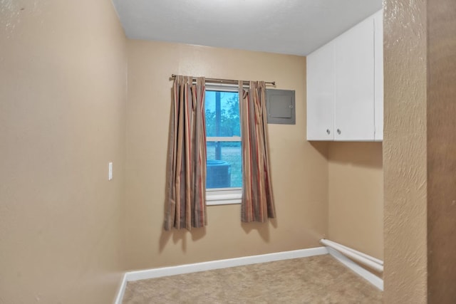 116 W Robinson Rd, Big Spring, TX 79720 - unfurnished room with electric panel, carpet flooring, and baseboards