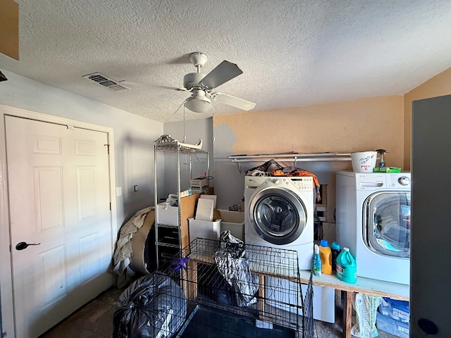 laundry area featuring ceiling fan, a textured ceiling, and independent washer and dryer