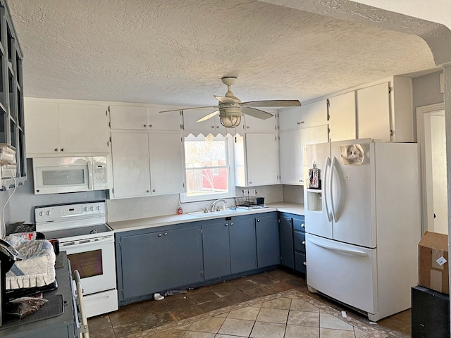 kitchen featuring sink, a textured ceiling, white cabinets, and white appliances