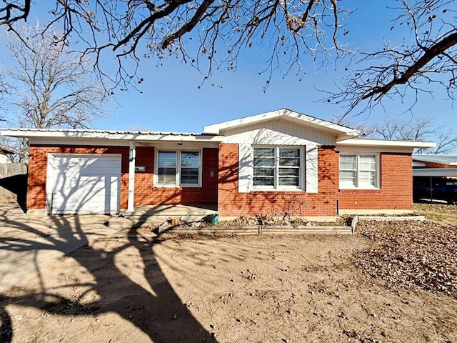 single story home featuring a garage and a carport