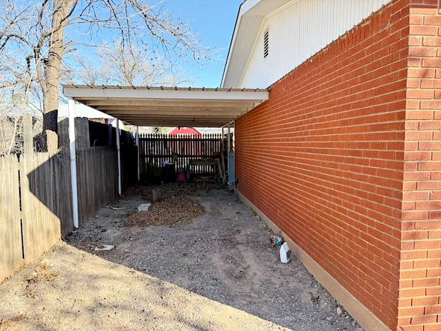 view of parking / parking lot with a carport