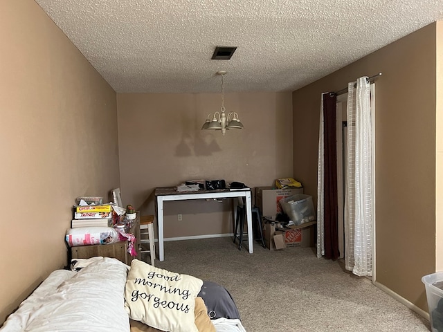 bedroom featuring a chandelier, carpet, a textured ceiling, and baseboards