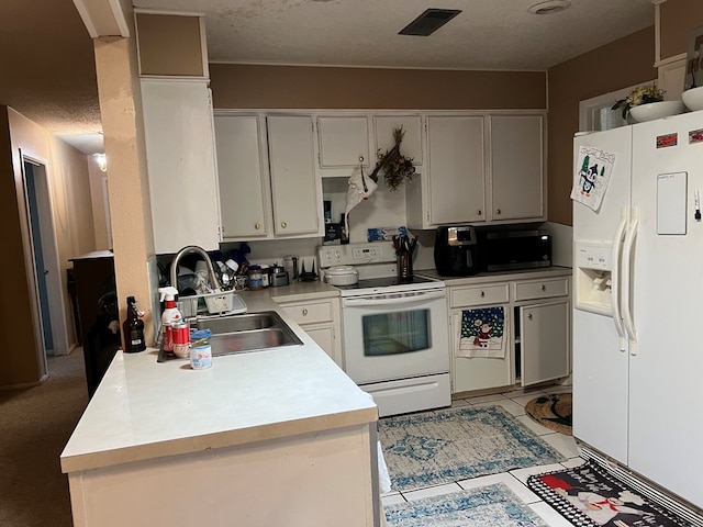 kitchen with a textured ceiling, white appliances, a sink, white cabinets, and light countertops