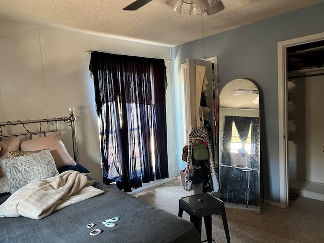 bedroom featuring a textured ceiling, baseboards, and carpet flooring