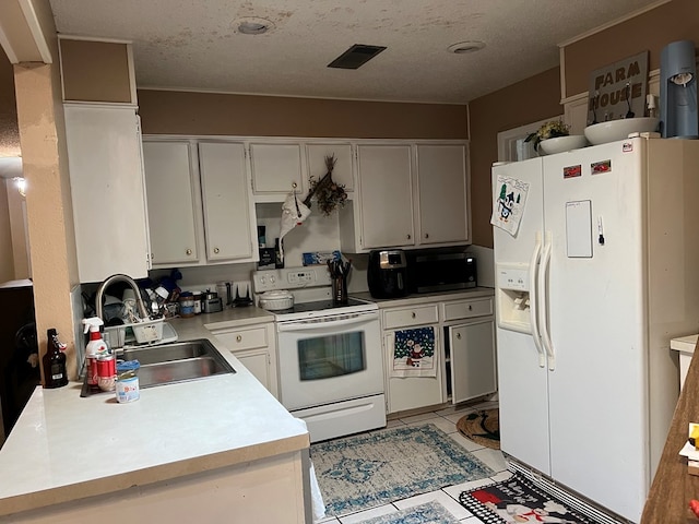 kitchen with white appliances, light countertops, a textured ceiling, white cabinetry, and a sink