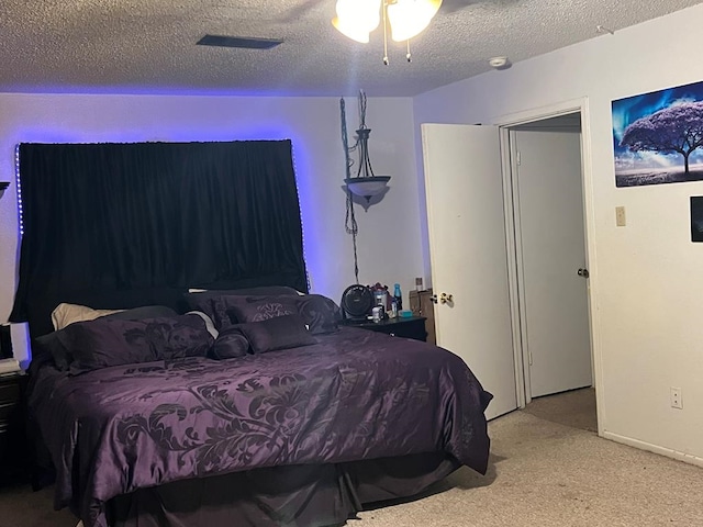 carpeted bedroom with a textured ceiling