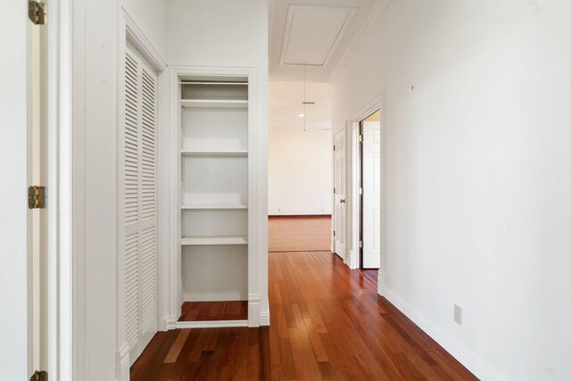 hall featuring dark hardwood / wood-style flooring and ornamental molding