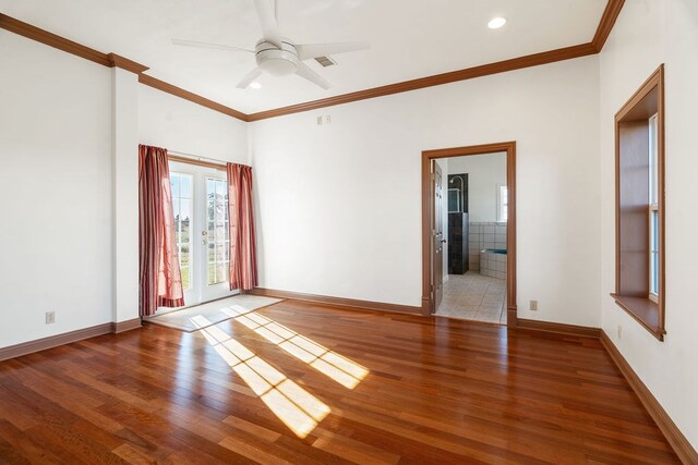 unfurnished room with hardwood / wood-style flooring, ceiling fan, crown molding, and french doors