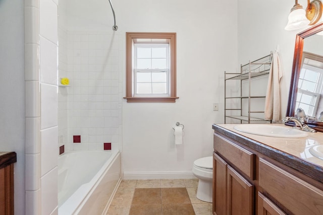 full bathroom with tile patterned flooring, vanity, toilet, and tiled shower / bath combo