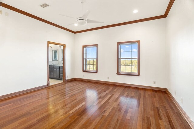 interior space with hardwood / wood-style floors, ceiling fan, and crown molding