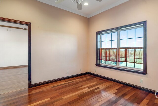 spare room featuring crown molding, ceiling fan, and hardwood / wood-style flooring