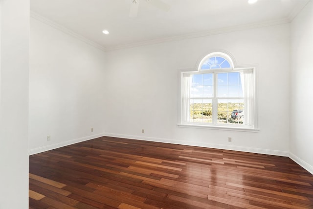 empty room with crown molding, dark hardwood / wood-style flooring, and ceiling fan