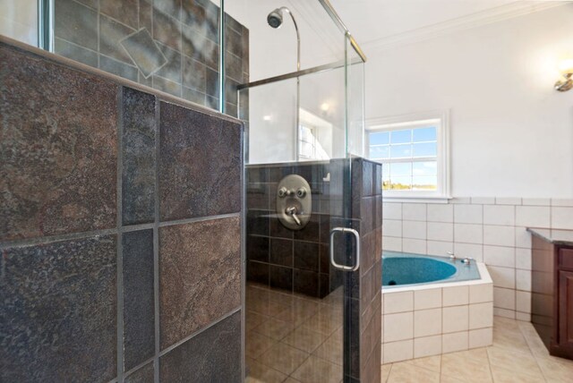 bathroom with vanity, tile patterned floors, crown molding, tile walls, and independent shower and bath