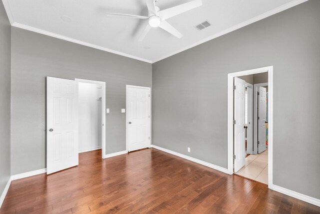 2201 Hereford Blvd, Midland, TX 79707 - unfurnished bedroom featuring visible vents, ornamental molding, baseboards, and wood finished floors
