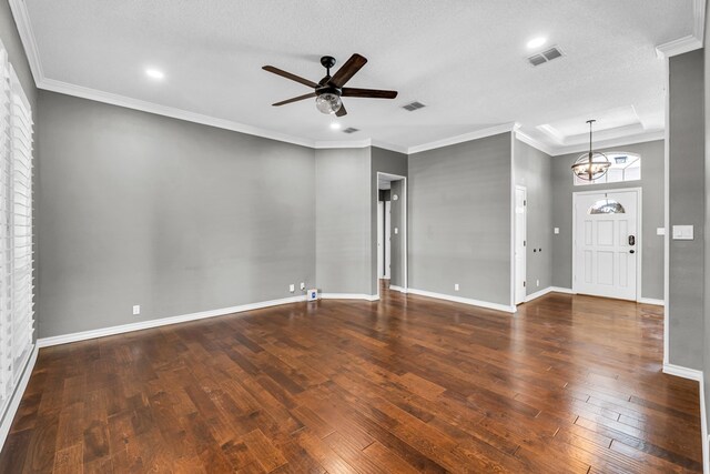 2201 Hereford Blvd, Midland, TX 79707 - unfurnished living room featuring wood-type flooring, baseboards, visible vents, and ceiling fan with notable chandelier