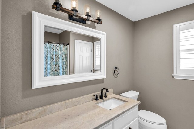 2201 Hereford Blvd, Midland, TX 79707 - bathroom with toilet and vanity