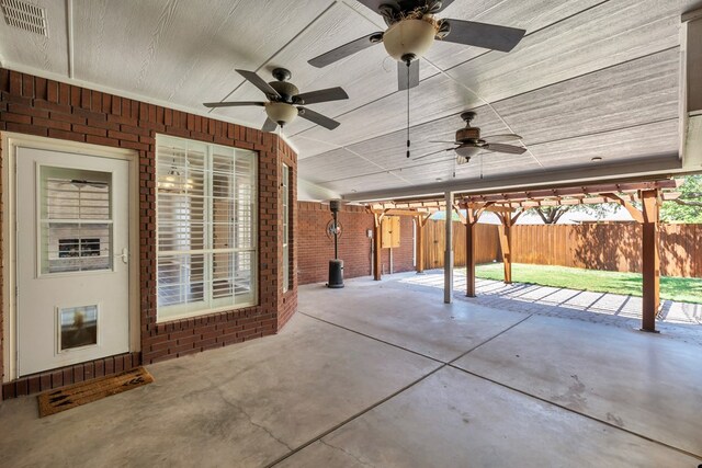 2201 Hereford Blvd, Midland, TX 79707 - view of patio with ceiling fan, visible vents, and fence
