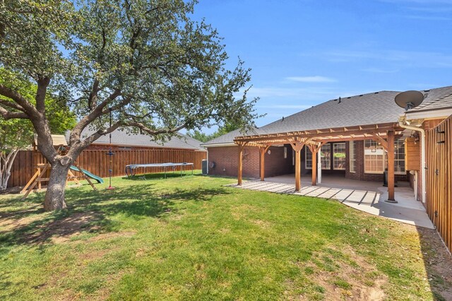 2201 Hereford Blvd, Midland, TX 79707 - view of yard with a pergola, a fenced backyard, a patio, and a trampoline