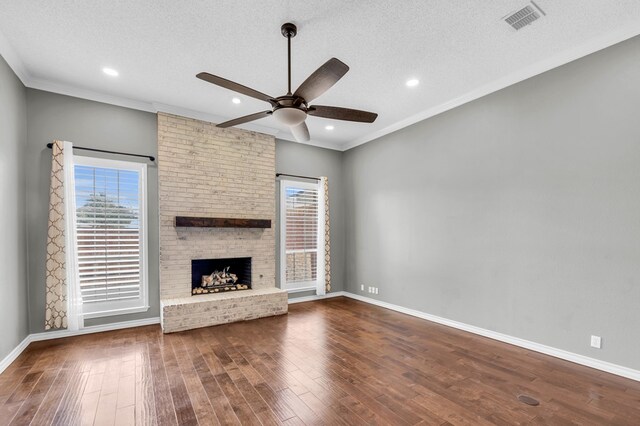 2201 Hereford Blvd, Midland, TX 79707 - unfurnished living room featuring ceiling fan, a textured ceiling, baseboards, wood finished floors, and visible vents