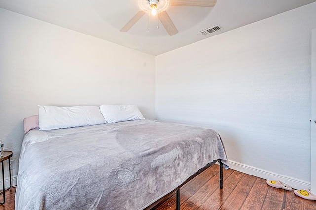 bedroom with wood-type flooring and ceiling fan