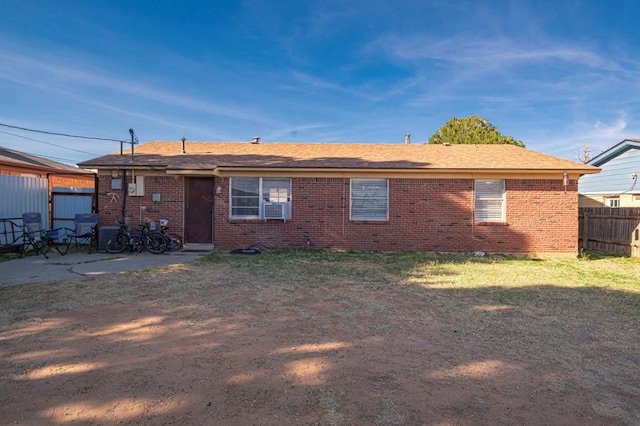 back of house with cooling unit, a yard, and a patio