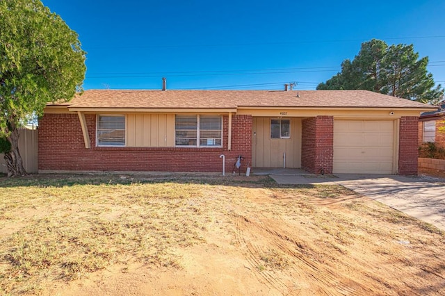 ranch-style house featuring a front lawn and a garage