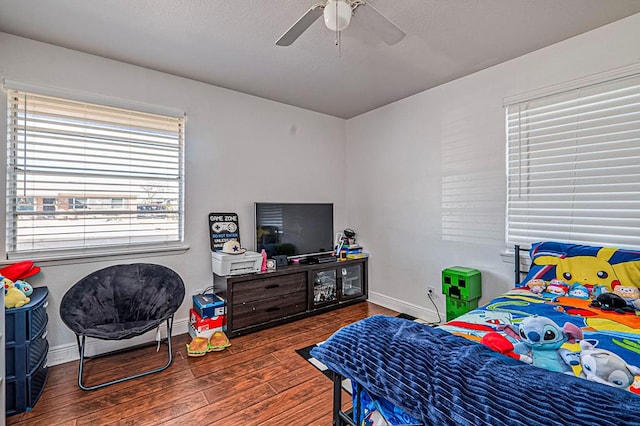 bedroom with hardwood / wood-style flooring and ceiling fan