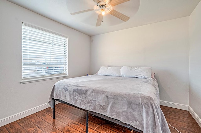 bedroom featuring ceiling fan and dark wood-type flooring