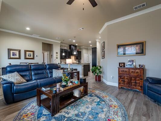 1906 Overshine Ln, Midland, TX 79705 - living room with ceiling fan, wood finished floors, crown molding, recessed lighting, and baseboards