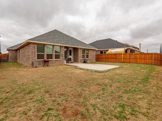 1906 Overshine Ln, Midland, TX 79705 - back of property featuring a patio and brick siding
