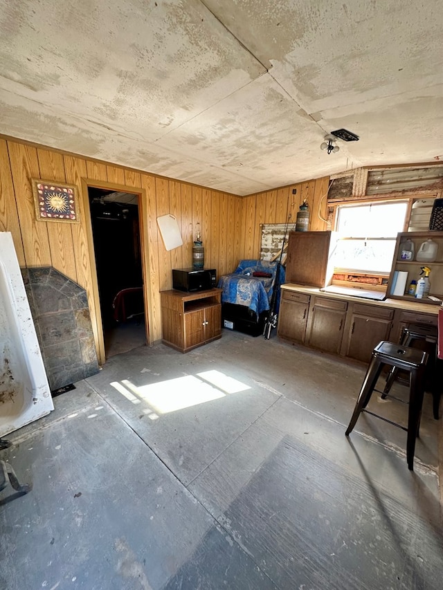 misc room featuring wood walls