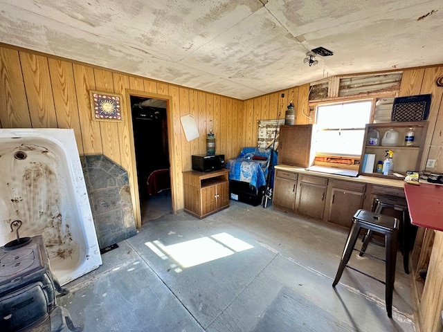 miscellaneous room with wooden walls